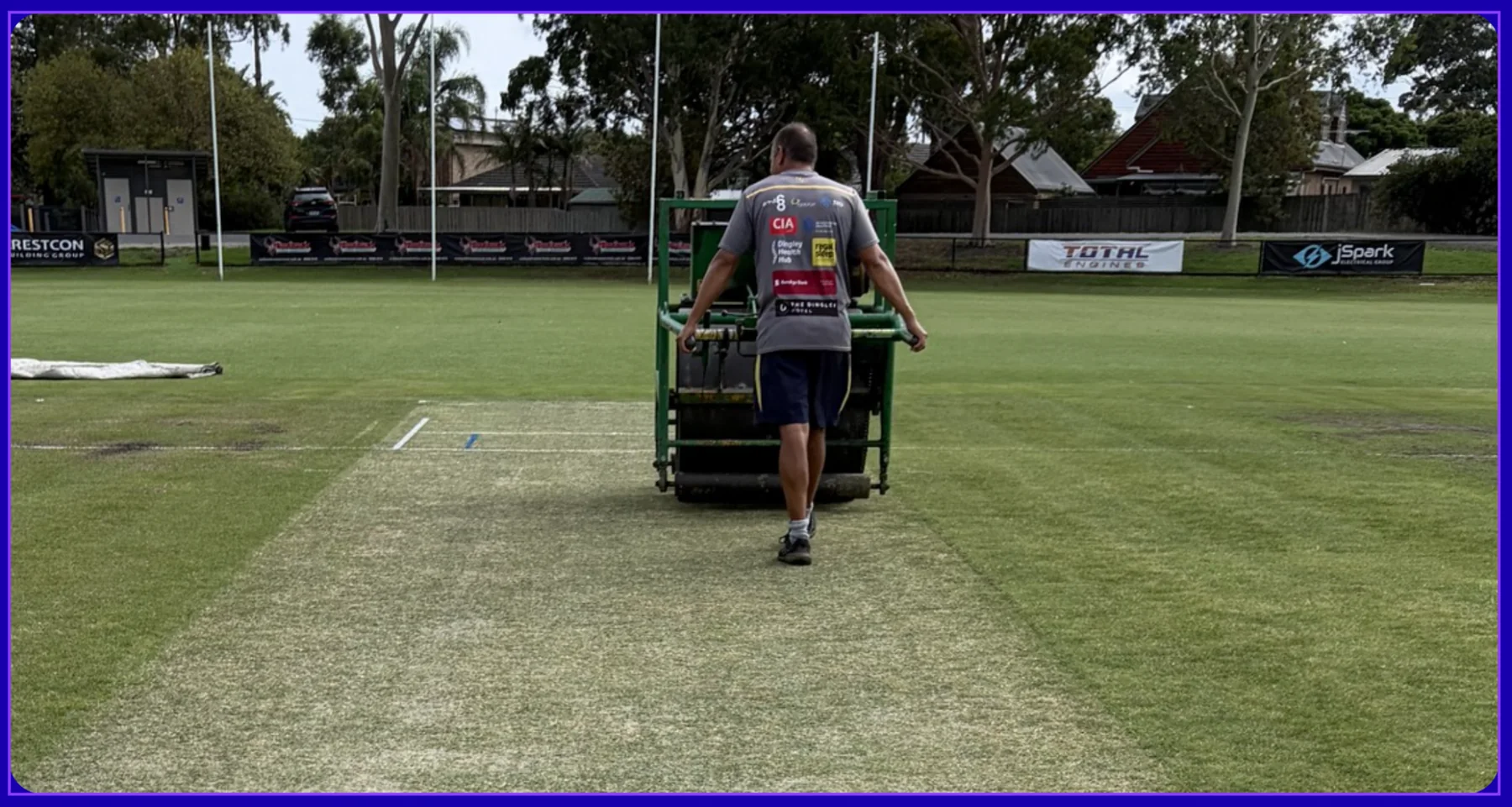 Preparing the cricket wicket at Dingley