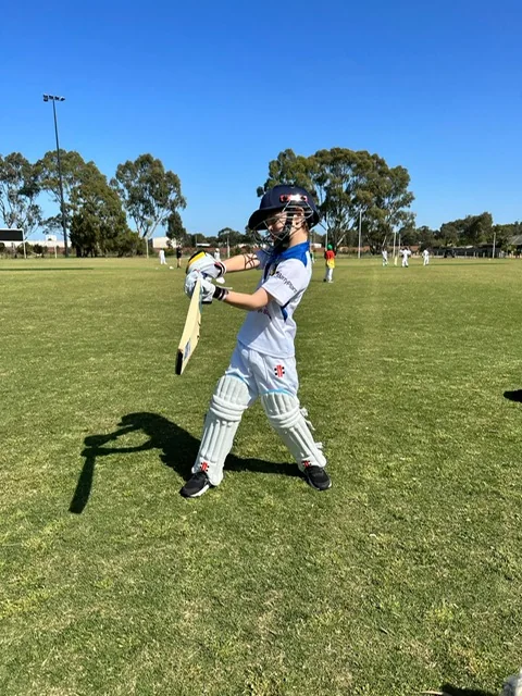 Young Dingley cricketer practicing a batting shot