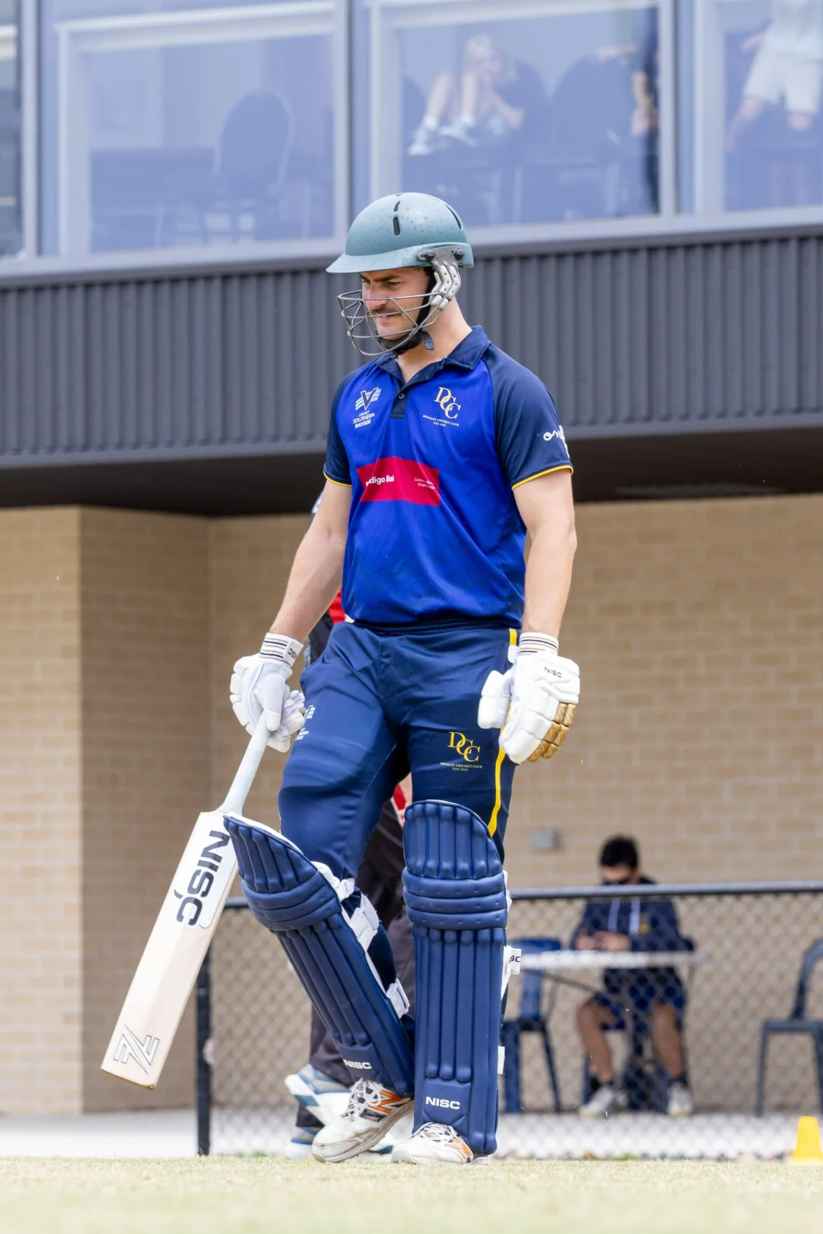 Dingley senior batter walking to the crease